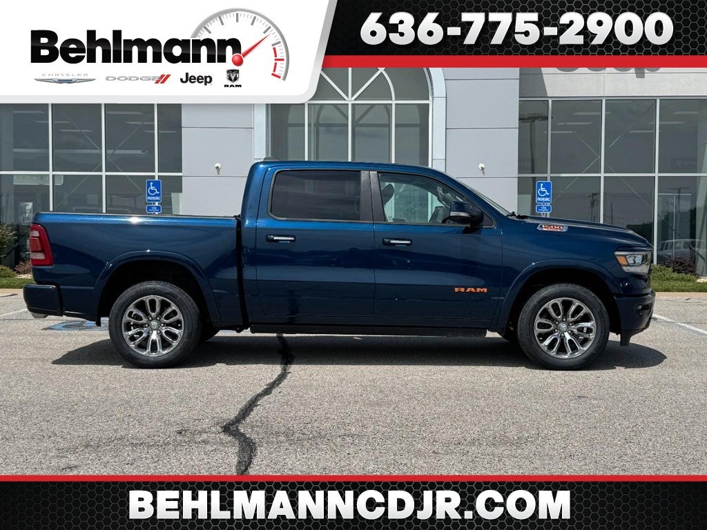 2021 RAM 1500 Laramie in Patriot Blue Pearlcoat — front three-quarter view